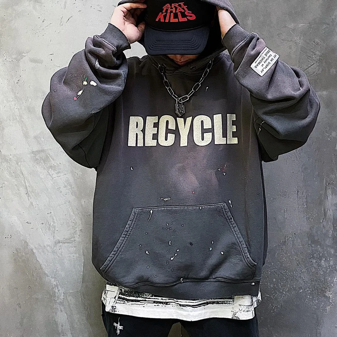 GALLERY DEPT. 90'S RECYCLE HOODIE WASHED BLACK 90'S washed hoodie with distressed eco-friendly slogans. Washed black S-XL. Ready-made garments are washed and dyed again. Multiple spots throughout the body are spray-faded. The ribs are cut and worn.